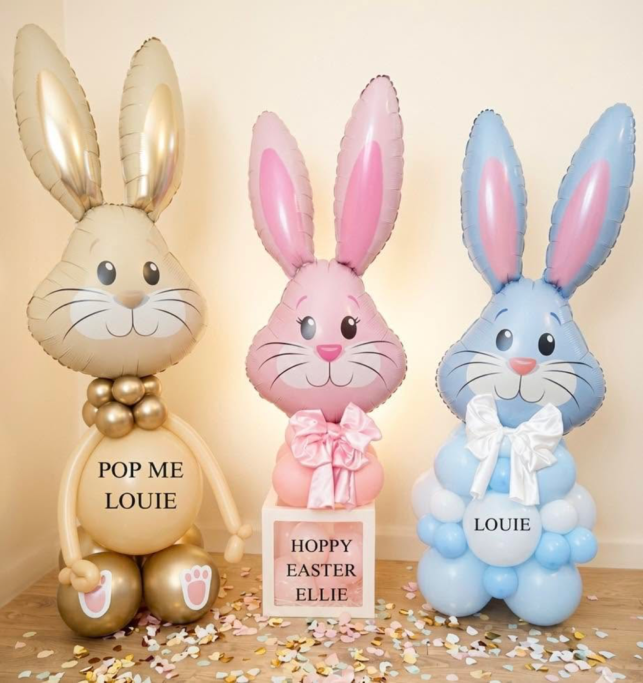 Easter bunny balloon sculptures in gold, pink and blue